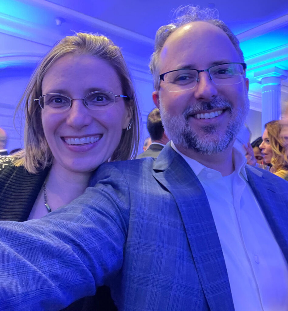 A woman and a man taking a selfie at the Gala.