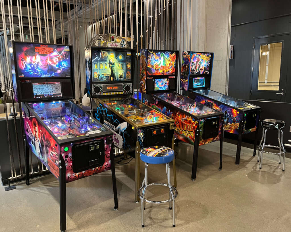 Four pinball machines in the Twitch arcade room.